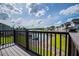 Exterior deck with lake views and black metal railings at 325 Berry Ct, Villa Rica, GA 30180