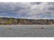 Expansive lake view with kayakers enjoying the water, surrounded by colorful shoreline trees at 325 Berry Ct, Villa Rica, GA 30180