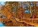 Scenic view of a wooden path along the lake during fall with trees in autumn colors at 325 Berry Ct, Villa Rica, GA 30180