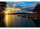 Picturesque lake view at sunset, showcasing numerous boats docked and ready for enjoyment at 325 Berry Ct, Villa Rica, GA 30180