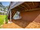 Enjoy outdoor living with this cozy under-deck swing set at 325 Berry Ct, Villa Rica, GA 30180