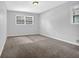 Bedroom with neutral walls, carpet flooring, and a window with natural light at 4246 Rue Saint Michel, Stone Mountain, GA 30083
