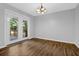 A formal dining room offers hardwood floors, fresh paint, and views of the back deck at 4246 Rue Saint Michel, Stone Mountain, GA 30083
