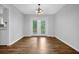 A formal dining room offers hardwood floors, fresh paint, and views of the back deck at 4246 Rue Saint Michel, Stone Mountain, GA 30083