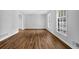 The living room has new hardwood floors, fresh paint, and bright windows at 4246 Rue Saint Michel, Stone Mountain, GA 30083