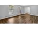 A spacious living room offers hardwood floors, fresh paint, and bright windows at 4246 Rue Saint Michel, Stone Mountain, GA 30083