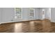 A spacious living room offers hardwood floors, fresh paint, and bright windows at 4246 Rue Saint Michel, Stone Mountain, GA 30083