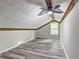 Attic bedroom showcasing wood beams and hard wood flooring at 2685 Peachtree Walk Walk, Duluth, GA 30096
