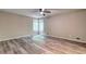 Bedroom featuring scenic windows, neutral paint, and wood flooring at 2685 Peachtree Walk Walk, Duluth, GA 30096