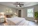 Well-lit bedroom with a comfy bed, chic nightstands, and a calming ambiance at 2685 Peachtree Walk Walk, Duluth, GA 30096