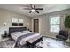 Serene bedroom with a cozy chair, a large window, and tasteful decor for a tranquil space at 2685 Peachtree Walk Walk, Duluth, GA 30096