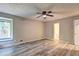 Bright, neutral bedroom features a view to an en suite bathroom at 2685 Peachtree Walk Walk, Duluth, GA 30096