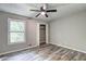 Bright bedroom with closet and window offering a scenic view at 2685 Peachtree Walk Walk, Duluth, GA 30096
