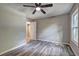 Bedroom featuring a ceiling fan, closet, and scenic backyard window view at 2685 Peachtree Walk Walk, Duluth, GA 30096