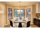 Cozy breakfast nook with backyard views, perfect for casual dining and morning coffee at 2685 Peachtree Walk Walk, Duluth, GA 30096