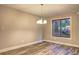 Bright dining area featuring hardwood floors and a stylish chandelier at 2685 Peachtree Walk Walk, Duluth, GA 30096