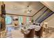 Staged living room featuring a stone fireplace, vaulted ceiling, neutral furniture, and wood-look flooring at 2685 Peachtree Walk Walk, Duluth, GA 30096