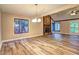Spacious living room with fireplace, hardwood floors and two large windows at 2685 Peachtree Walk Walk, Duluth, GA 30096