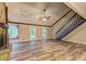 Spacious living room with fireplace, hardwood floors and a staircase at 2685 Peachtree Walk Walk, Duluth, GA 30096