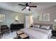 Serene main bedroom with a plush bed, stylish furnishings, and soft decor accents at 2685 Peachtree Walk Walk, Duluth, GA 30096