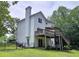 Spacious backyard with a wooden deck, fenced-in area, and ample greenery at 3152 Andora Sw Trl, Marietta, GA 30064
