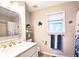 Well-lit bathroom with vanity and shower-tub combination at 3152 Andora Sw Trl, Marietta, GA 30064