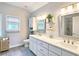 Bright bathroom with double vanity, large mirrors, and modern fixtures at 3152 Andora Sw Trl, Marietta, GA 30064