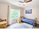 Cozy bedroom with natural light, hardwood floors, and comfortable bed at 3152 Andora Sw Trl, Marietta, GA 30064