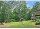Backyard view featuring a charming gazebo, trees, and a lush lawn, offering a peaceful retreat at 3152 Andora Sw Trl, Marietta, GA 30064