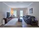 Inviting living room with ample seating, a television, and natural light, offering a comfortable space at 3152 Andora Sw Trl, Marietta, GA 30064
