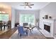 Comfortable living room with fireplace, ceiling fan, hardwood floors, and natural light for relaxing or entertaining at 3152 Andora Sw Trl, Marietta, GA 30064
