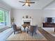 Cozy living room with fireplace, ceiling fan, hardwood floors, large windows and neutral decor at 3152 Andora Sw Trl, Marietta, GA 30064