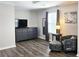 Bedroom sitting area with natural light, dark wood floors, and comfortable seating at 3152 Andora Sw Trl, Marietta, GA 30064