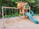 Wooden playground with swings and a slide provides children a safe and fun place to play in the community at 3152 Andora Sw Trl, Marietta, GA 30064