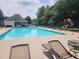 Community pool with lounge chairs, umbrellas, and a play area offers a refreshing and fun experience at 3152 Andora Sw Trl, Marietta, GA 30064