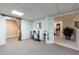 Finished basement area with carpeted floor and ample space for activities at 525 Avala Ct, Johns Creek, GA 30022