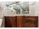 Bathroom featuring dark wood vanity, granite countertop and decorative tile accent wall at 525 Avala Ct, Johns Creek, GA 30022