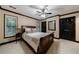 Spacious bedroom featuring a wooden sleigh bed, side tables, and neutral colors at 525 Avala Ct, Johns Creek, GA 30022