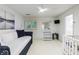Bright room with shuttered window, a daybed, and baby furniture at 525 Avala Ct, Johns Creek, GA 30022