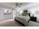 Serene bedroom with large bed, carpet flooring, and decorative wall art at 525 Avala Ct, Johns Creek, GA 30022