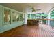 Deck featuring a stone grilling station and wooded backyard views at 525 Avala Ct, Johns Creek, GA 30022