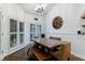 Bright dining room with a large table, bench seating, and stylish chandelier at 525 Avala Ct, Johns Creek, GA 30022
