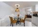 Cozy breakfast nook featuring a round glass table with seating for casual dining at 525 Avala Ct, Johns Creek, GA 30022