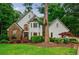 Charming two-story home featuring a stone facade, white siding and a well-manicured lawn at 525 Avala Ct, Johns Creek, GA 30022