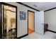 Hallway with access to a bathroom with marble floors and a dresser at 525 Avala Ct, Johns Creek, GA 30022