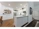 Modern kitchen with white cabinets, granite countertops, and stainless steel appliances at 525 Avala Ct, Johns Creek, GA 30022