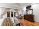 Sunlit main bedroom boasts private balcony access, hardwood floors and a large stylish mirror at 525 Avala Ct, Johns Creek, GA 30022