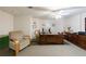 Spacious home office featuring a large wooden desk and comfortable seating at 525 Avala Ct, Johns Creek, GA 30022