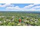 Aerial view of the house nestled in a lush green neighborhood under a cloudy blue sky at 5705 Cannonero Dr Dr, Alpharetta, GA 30005