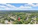 Aerial view of neighborhood with tree coverage, a single-Gathering house identified by a red pin at 5705 Cannonero Dr Dr, Alpharetta, GA 30005